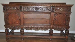Antique buffet table with intricate wood marquetry